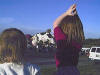 Beth_n_Becky_Watch_Cow_Balloon_at_Plano_Baloon_Festival_2002.jpg (308222 bytes)