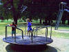 Beth_n_Becky_on_merry_go_round.jpg (416883 bytes)